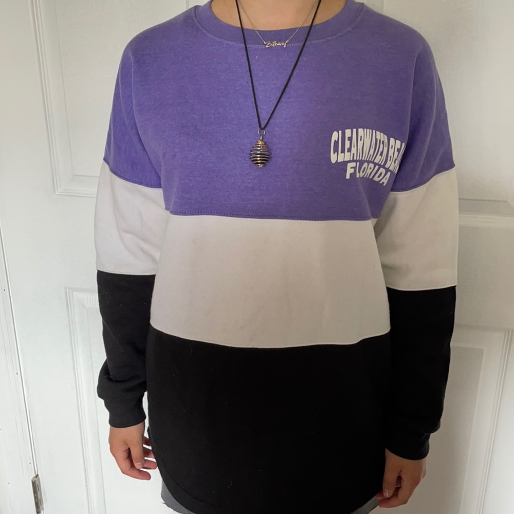 Purple, black, and white pull over